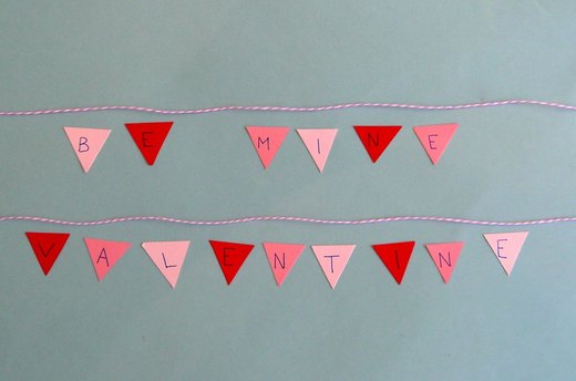 Glue onto twine.