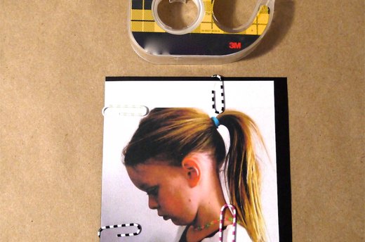 Tape the Silhouette to Black Card Stock