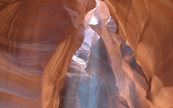 Characteristic shafts of light shining down through Antelope Canyon.
