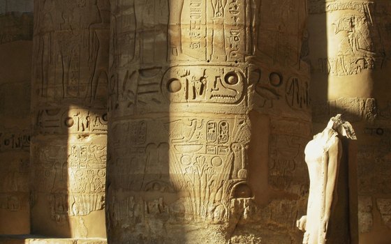 Hieroglyphics and carvings adorn the columns of Karnak's temples.