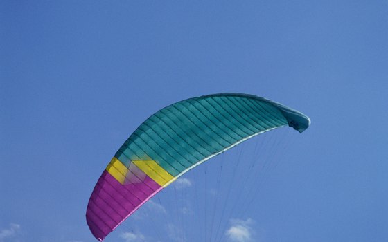Activities include parasailing over the Gulf of Mexico.