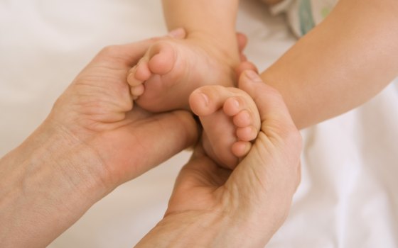 Tranquil Passage teaches infant massage to strengthen the infant-parent bond.