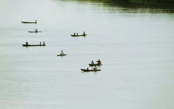 Tourists and locals canoe on the Amazon River in Brazil.