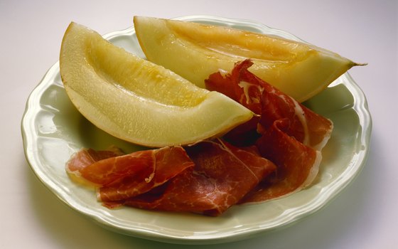 The composed combination of Prosciutto and melon is a traditional Parmesan appetizer.