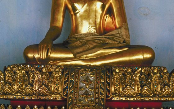 Gold Buddha sits in the Wat Phra Kaew, a temple inside the Grand Palace.