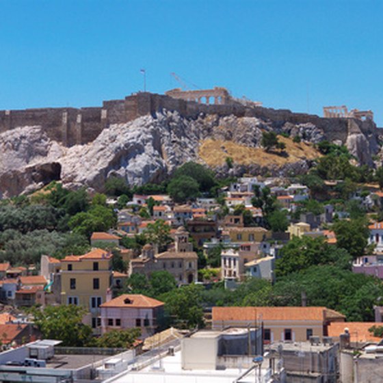 Many travelers enjoy visiting Greece's ancient ruins.