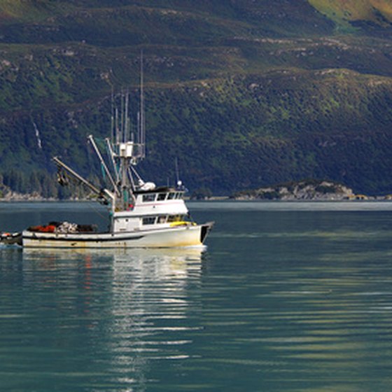 A fishing boat cruises through Alaskan waters.