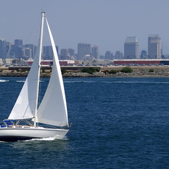 Visitors enjoy the sea breeze as they sail through San Diego Bay on a chartered boat