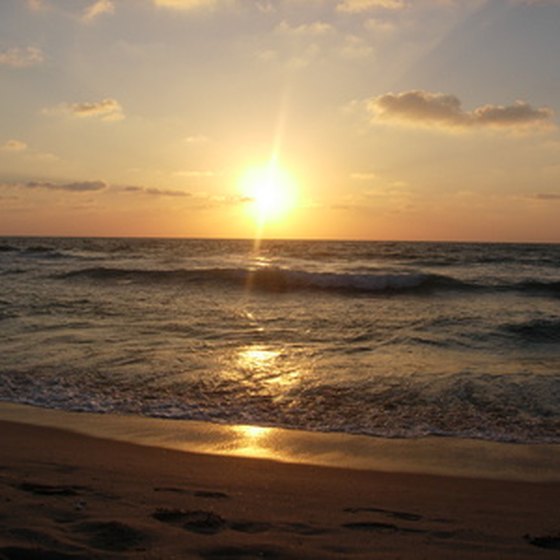After playing golf, Sunset Beach vacationers can visit the beach to watch the sun set over the coast.