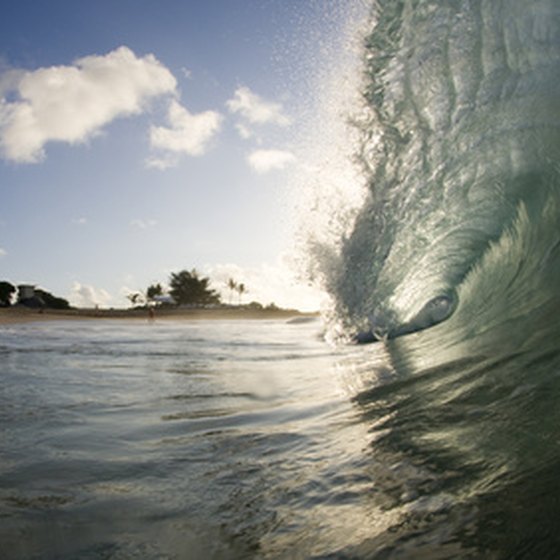 Surf and sand, such as this break on Oahu, are among the best free attractions in Hawaii.