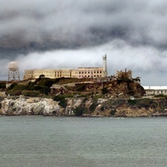 Morning Coastal Fog clears over Alcatraz Island in San Francisco.