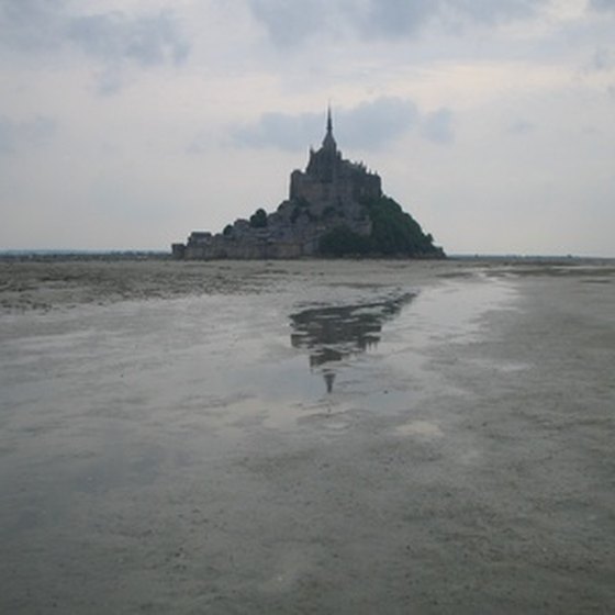 Mont Saint Michel rises from the tidal basin of the Gulf of St. Malo.