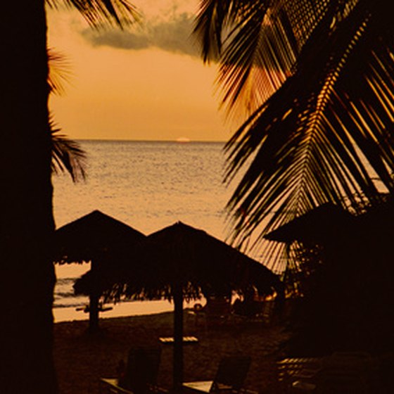 Catch sunsets from a private beach palapa year-round in Aruba.