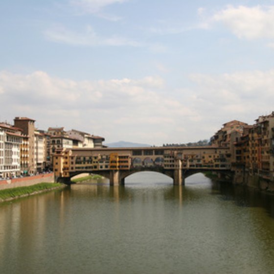 Walk across the Ponte Vecchio in Florence.