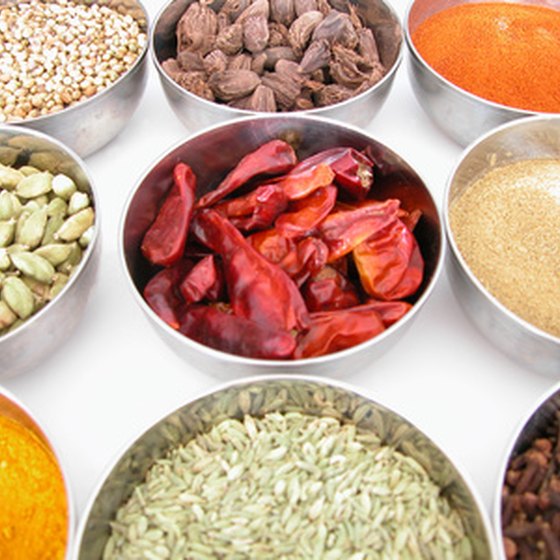 An array of spices goes into a typical Indian dish.