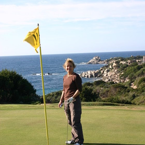 A golf enthusiast enjoys ocean views while playing a round of golf.