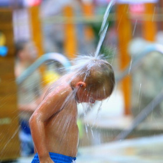 A boy enjoys a water park