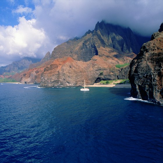 A snorkeling excursion via boat gives you glimpses of the stunning Na Pali coastline.