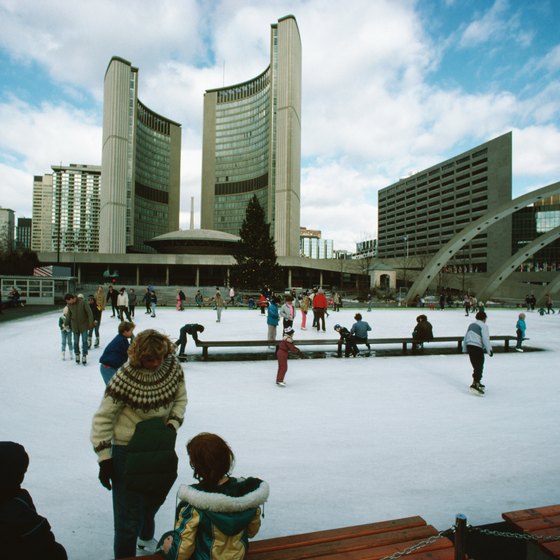 Ice skating by Toronto's town hall is a popular December pastime.