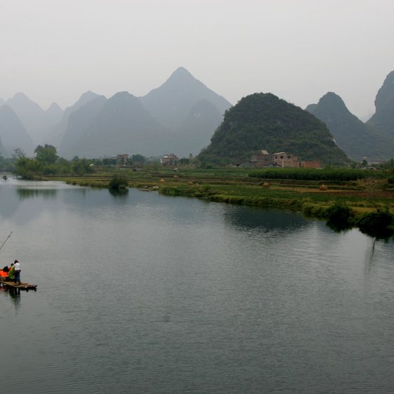 Riverboats take tourists along the Li River in Southern China.