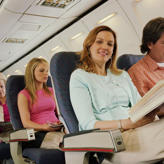 Sitting near an exit is just one of many factors that determine the safest seats on a airplane.