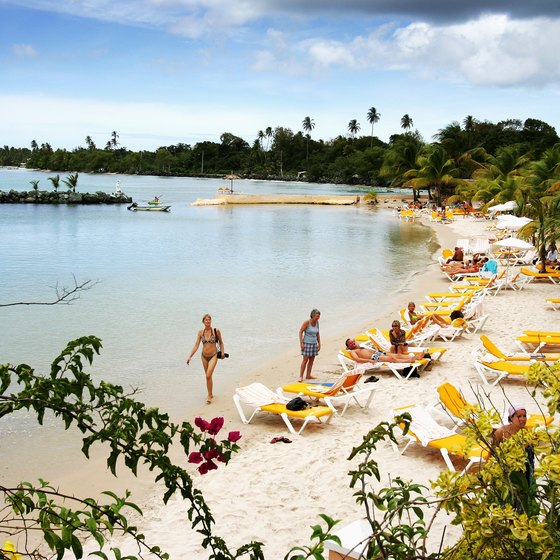 Visitors relax on Pigeon Point in Tobago.