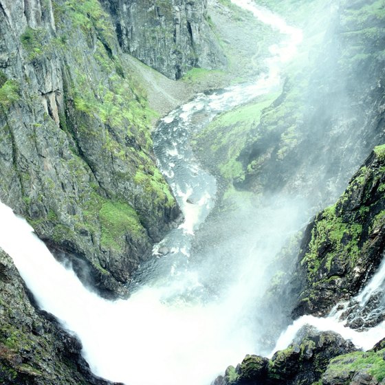 Tall cliffs and rushing waterfalls contribute to the drama of Norway's fjords.