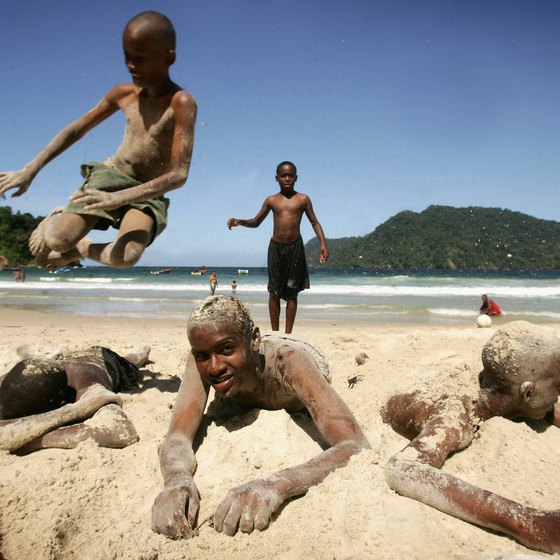 Local boys play on the beach at Maracas Bay in Trinidad.