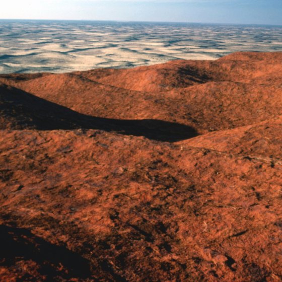 The Australian Outback is full of massive red sandstone formations like Uluru.