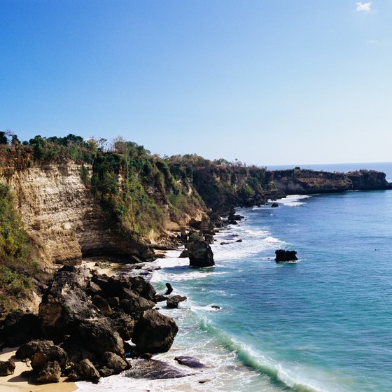 Fly internationally or take a series of ferries and domestic flights from Singapore to Bali, Indonesia.