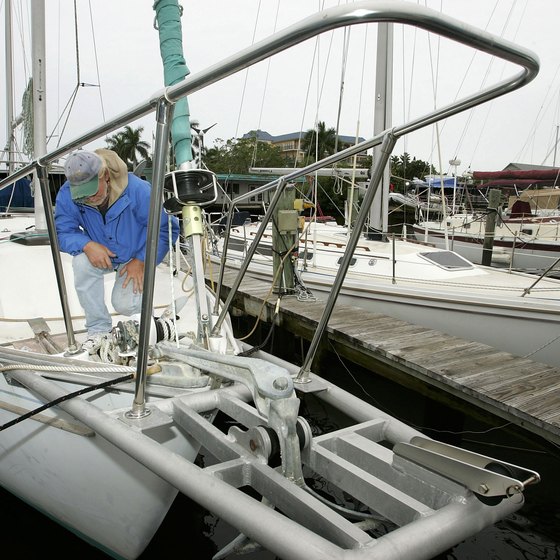 A boater checks his lines at a Naples dock