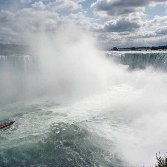 Vacationers on a Niagara Falls tour can ride the famous Maid of the Mist into the base of the falls.