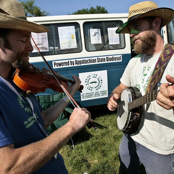 Appalachian State students make music next to their bio-diesel bus.