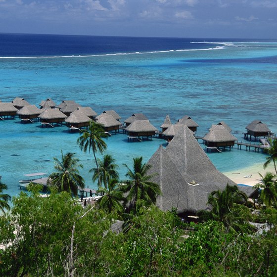 Overwater huts let guests stay as close as possible to the cerulean sea.