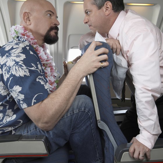 Consideration for neighbors can defuse tensions during a long middle-seat flight.