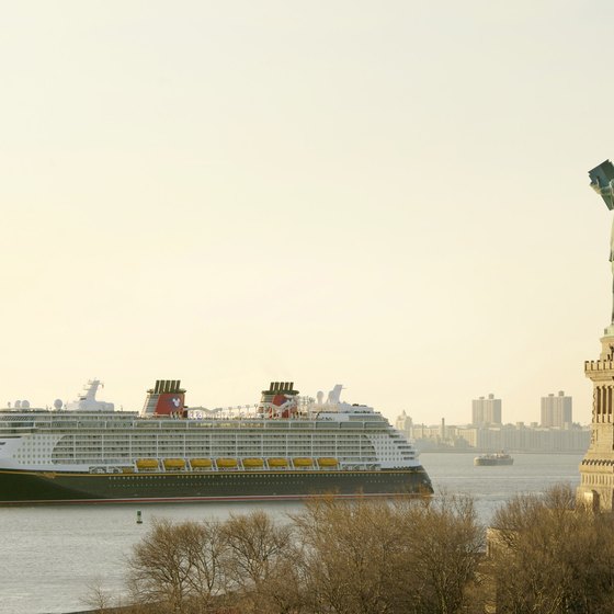 The 'Disney Fantasy' sails past the Statue of Liberty.