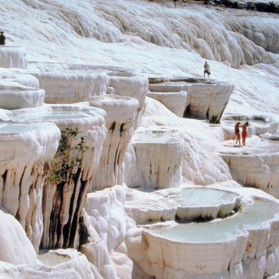 Enjoy the travertine terraces at Pamukkale.