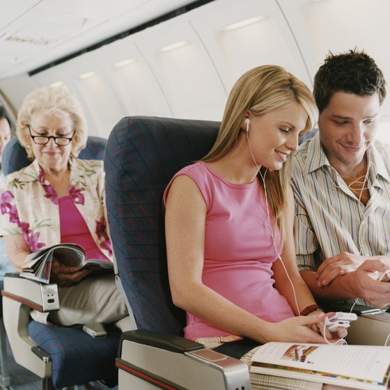 Minimize boredom on long flights by packing entertaining items and snacks.