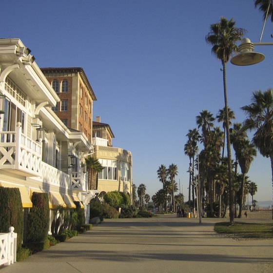 A wide boardwalk separates the sand from shops and restaurants at Venice Beach, California.