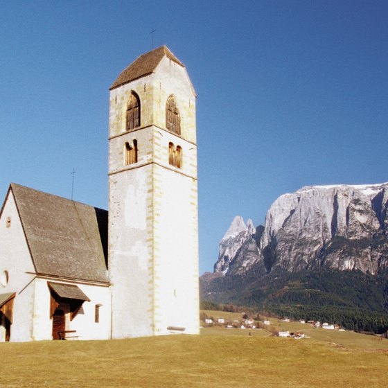 Medieval churches and castles dot the mountain towns of the Dolomites.
