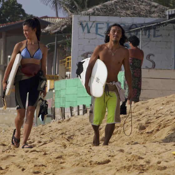 Surfers are a common sight on the beach in Hikkaduwa, Sri Lanka.
