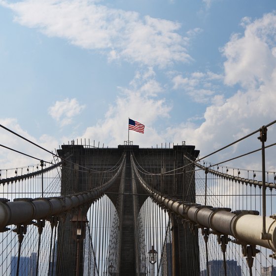 A romantic stroll across the Brooklyn Bridge offers impressive views of New York City.