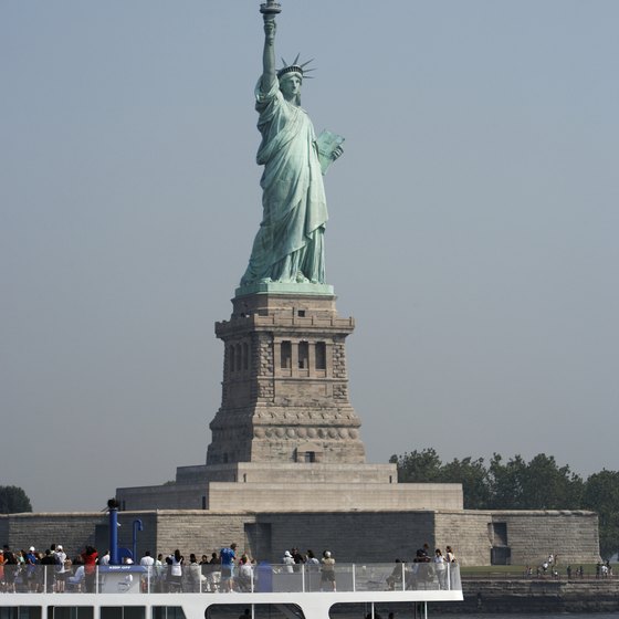 New York cruises travel past the Statue of Liberty.