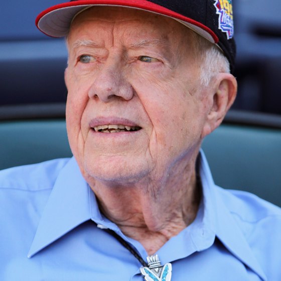 Former President Jimmy Carter sports an Atlanta Braves' baseball cap.