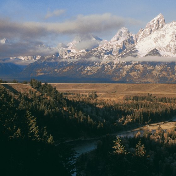 You may get views of the Grand Teton Mountains as you raft down the Snake River.