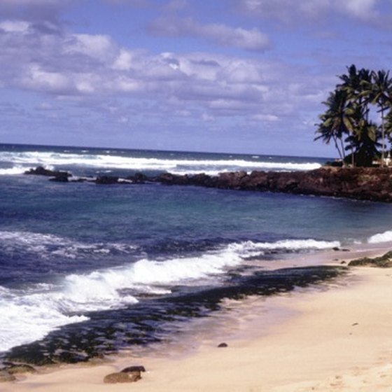 Sunbathe or surf at Oahu's secluded leeward Waianae beaches.