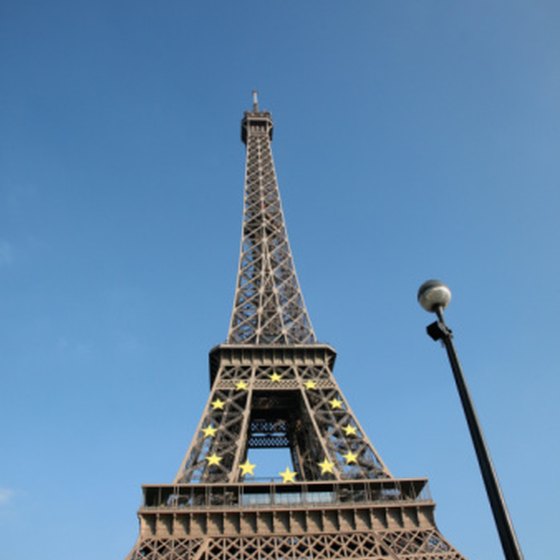Visit the Eiffel Tower in Paris, France, then travel on an overnight train to Venice, Italy.