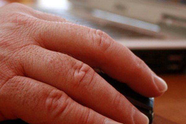 Hand on Mouse - Using the Computer image by evillager from Fotolia.com ...