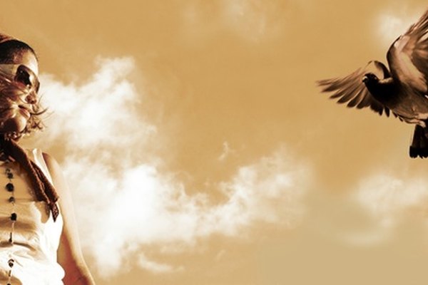 Girl watching a flying pigeon - sepia tone image by rgbspace from Fotolia.com ...