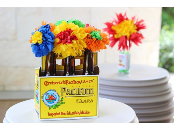 Arrange flowers in beer bottles